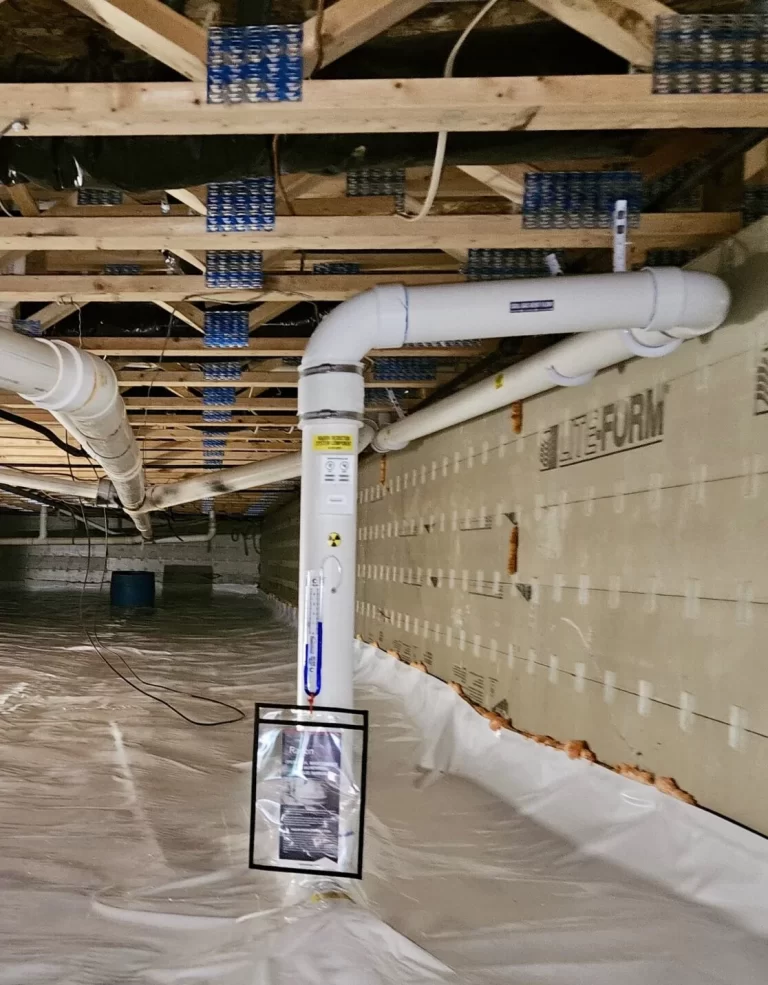 Crawlspace encapsulation with sealed vapor barrier and radon mitigation system.