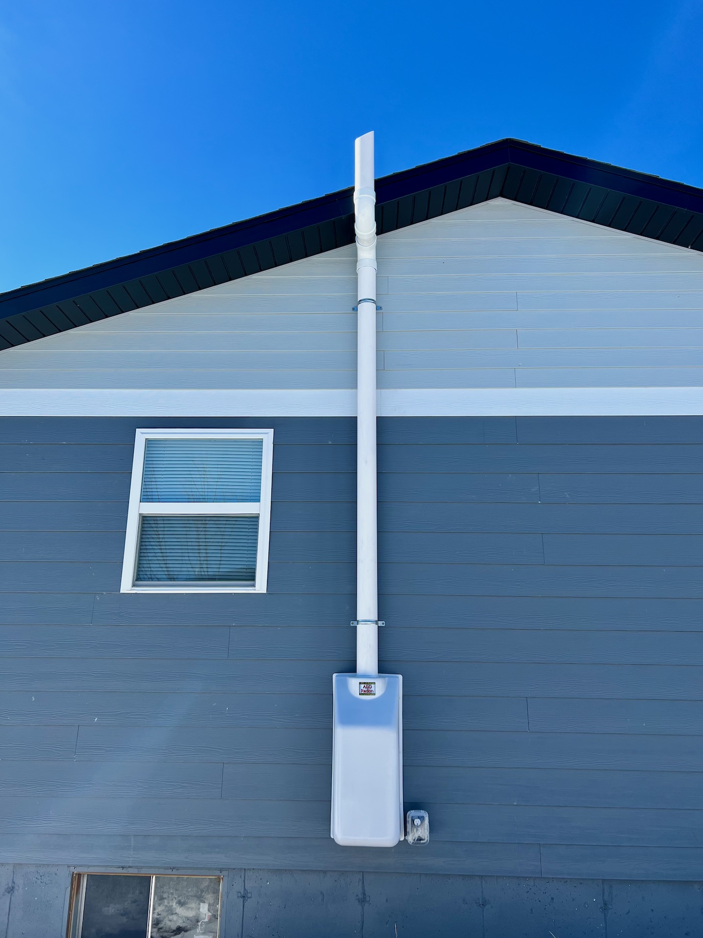 radon mitigation system blue white