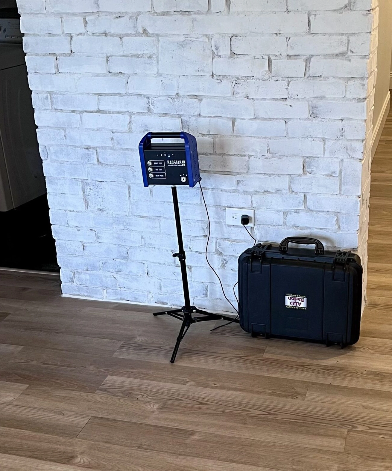 Professional radon testing monitor set up inside a home for residential radon testing.